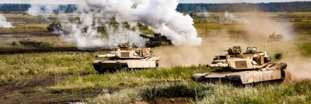 U.S. and Polish forces participate in a simulated tank battle  during the "Tank Battle" event held at Below Piskie Training Area.